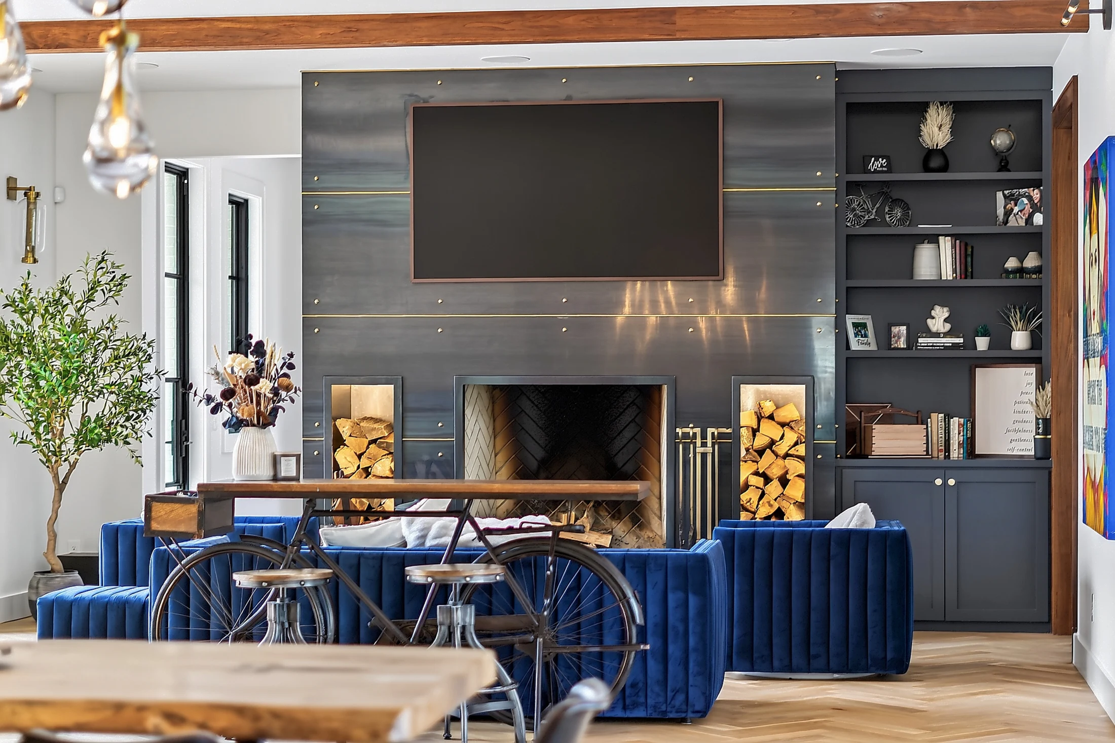 A steel fireplace anchors the great room