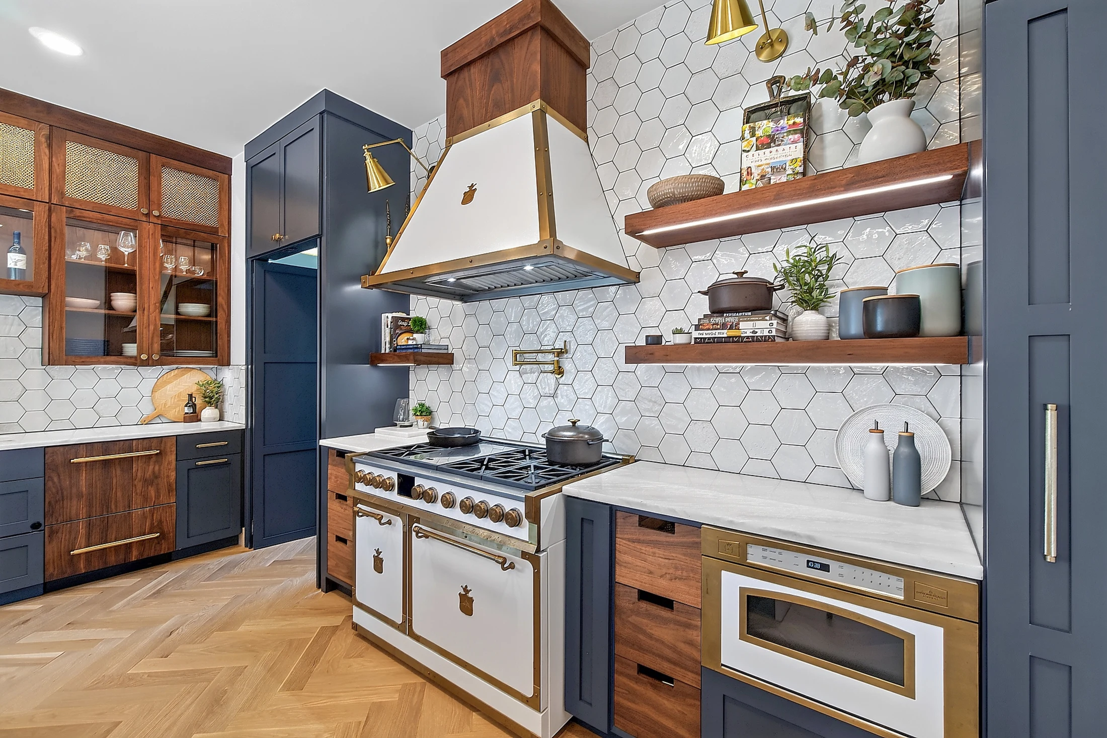 The Officine Gullo range, hood and microwave with brass details