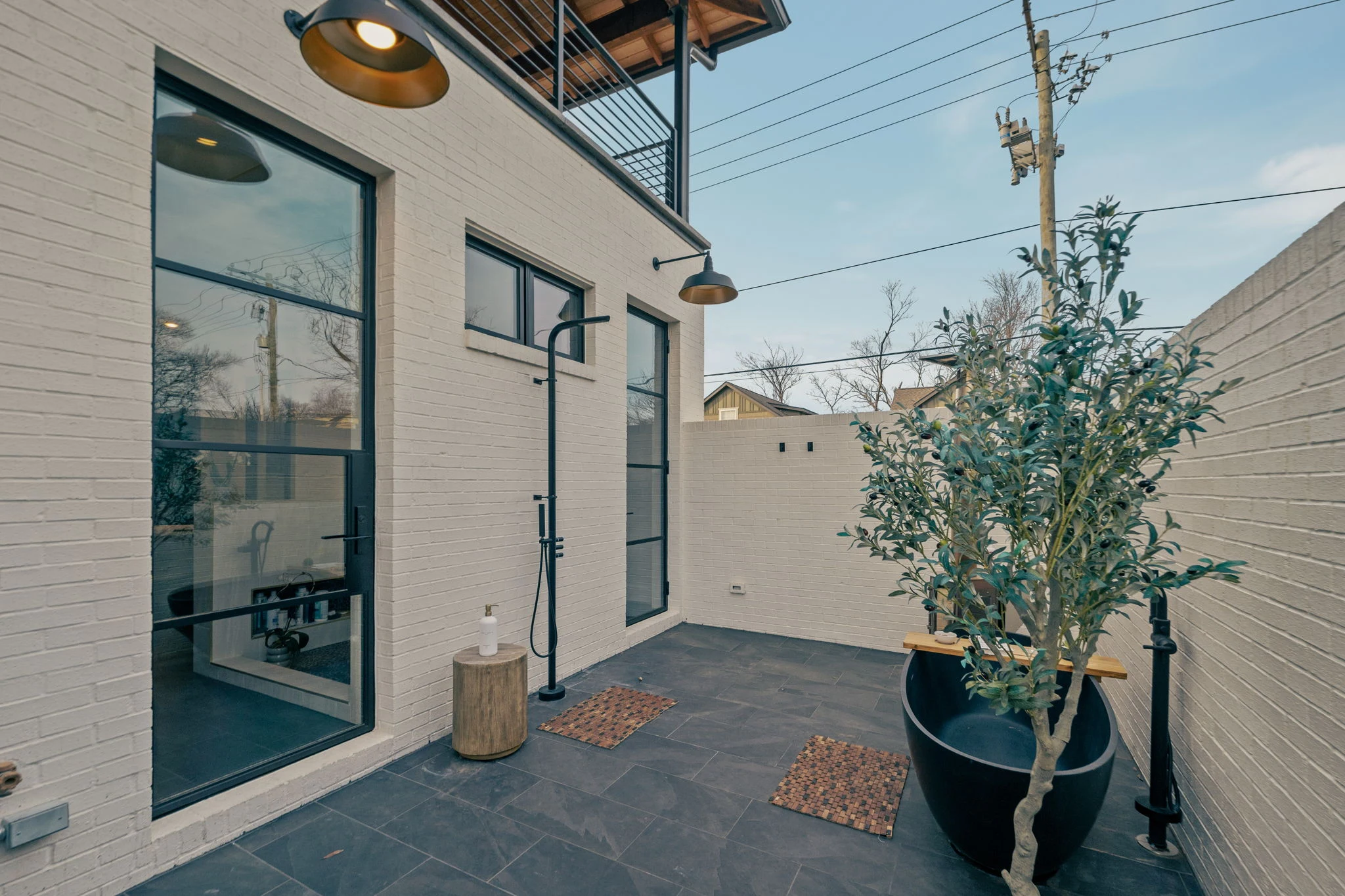 The private outdoor shower and bath directly off the primary bath