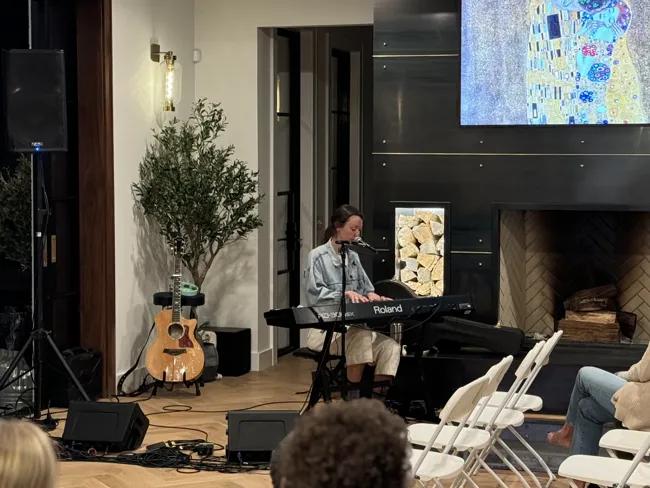 An intimate piano performance beside the great room fireplace