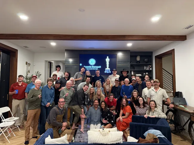 Friends gathered in the great room at 201 SW F Street